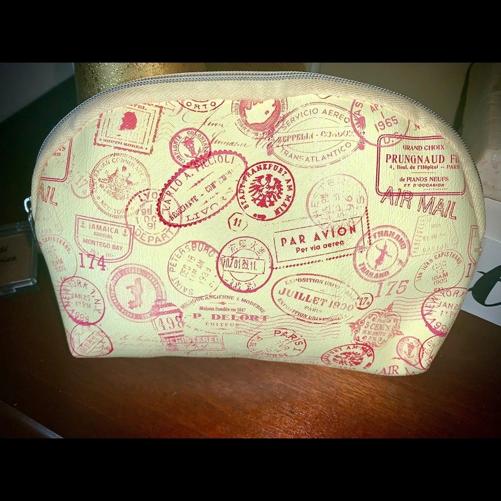 Cream Make up bag with a passport pattern w/ blush